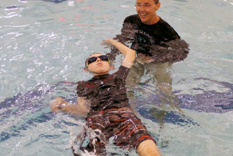 Boy learning how to swim