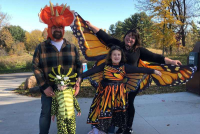Halloween in the park - family dressed in Halloween costumes