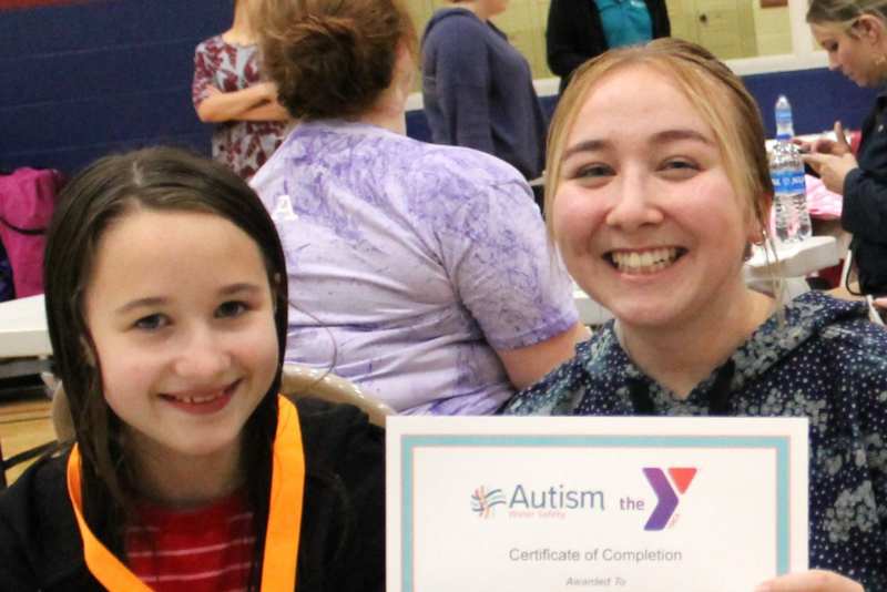 Young girl smiling with certificate