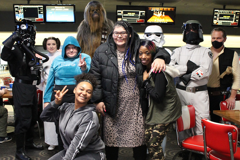 advocates dressed as star wars characters at a bowling event with kids